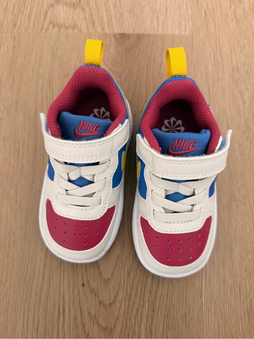 Nike Kids Low-Top Sneakers in White, Pink, Blue & Yellow